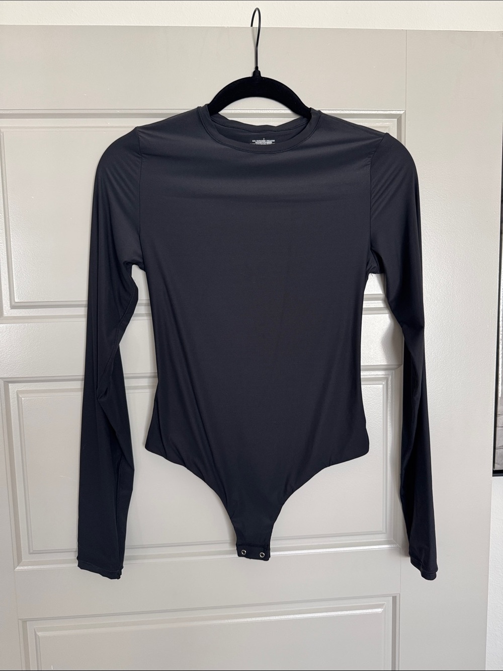 NWOT Women’s Black Long-Sleeve Crewneck One-Piece Bodysuit, S